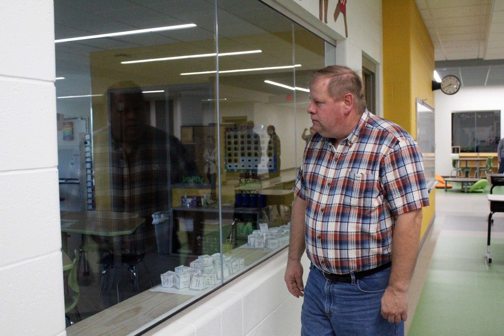 Paul looks into classroom